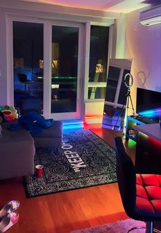 a living room filled with furniture and colorful lights