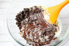 a bowl filled with chocolate chips and cream