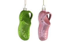 pair of shoes ornament hanging from chains on white background with clipping path