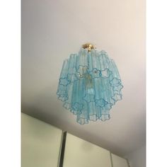 a blue chandelier hanging from the ceiling