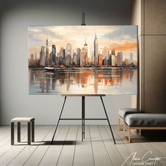 a large painting is hanging on the wall above a table in front of a bench