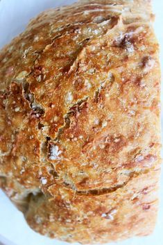 a loaf of bread sitting on top of a white plate