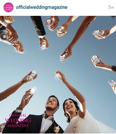 a group of people holding wine glasses in the air