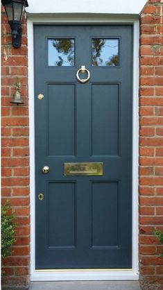 a blue front door with two sidelights