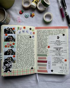 an open book with pictures on it next to some tape and other crafting supplies