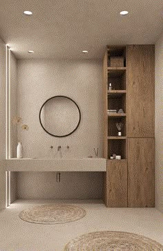 a bathroom with two round rugs on the floor and a sink in the middle