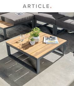 an image of a living room setting with couches and coffee table in the middle