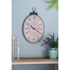 Description: Elevate your home decor with our Oval Wall Clock, a timeless piece featuring a weathered look, decorative numerals, and durable MDF wood and iron construction for long-lasting beauty. Simple Clock, Vintage Wall Clock, Clock Wall, Wood Wall Clock, Clock Wall Decor, Large Living Room, Clock Face, Mdf Wood, Wall Décor