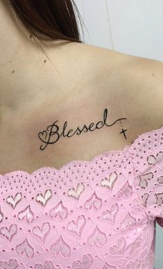 a woman with a tattoo on her shoulder that says, blessed