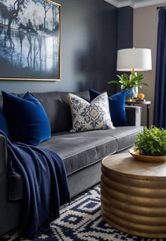 a living room filled with furniture and a large painting on the wall above the couch