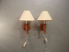 two lamps are plugged into the wall