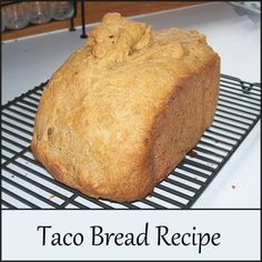 a loaf of taco bread sitting on top of a cooling rack with the words taco bread recipe