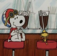 a cartoon dog sitting at a bar with two glasses and a crab on the counter