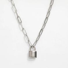 Add a playful touch to your jewelry collection with the Isabella Lock Pendant. Featuring a trendy paperclip chain and lock necklace, this piece is both stylish and functional. Perfect for everyday wear, it is sure to become a staple in your wardrobe. Chain length = 16 in + 2 in extender Lock size - 0.5 in Chain And Lock Necklace, Lock Chain Necklace, Lock Pendant, Chunky Chain Necklaces, Lock Necklace, Paper Clip, Wear It, Chain Lengths, Chain Length