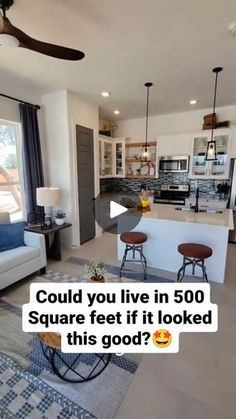 a living room filled with furniture and a ceiling fan