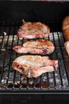 steaks and hot dogs cooking on the grill