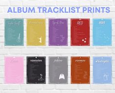 the album tracklist prints are displayed on a white brick wall