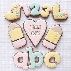 decorated cookies in the shape of letters and numbers