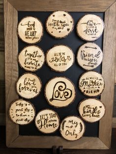 wood slices with handwritten names are displayed in a frame