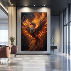 a painting of a bird with orange and yellow feathers on it's wings is hanging in an office lobby