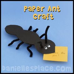 a paper ant craft on a blue background