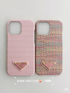 two cell phones with gold studs on the back and one has a pink case