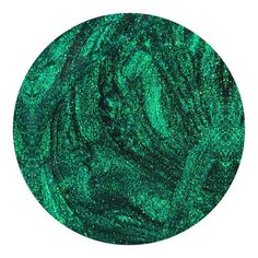 a green metallic disc with lots of glitter on it