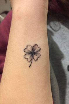 a four leaf clover tattoo on the wrist