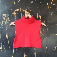 "Such a cute vintage 70's red turtleneck sleeveless crop top. Pullover entry. Stretchy and comfortable. Woven acrylic/spandex. Great vintage condition. Made in the USA. Size medium. Fits like an extra small-medium. The cutest top ever for real! Would look great styled so many different ways. Measurements: laying flat. Fabric stretches. Length: 12.5\" Armpit to armpit: 14+\"" Red Sleeveless Turtleneck, Red Concert, Black Flare Jeans, Concert Fit, Turtleneck Outfit, Tank Crop Top, Turtleneck Sleeveless, Red Turtleneck, Red Crop Top