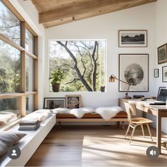 a living room filled with furniture and lots of windows