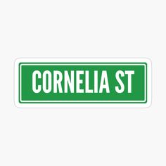 a green street sign with the word cornella st in white lettering on it sticker