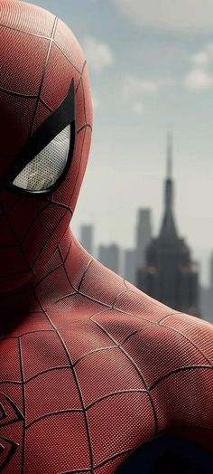 the amazing spider - man is in front of a cityscape