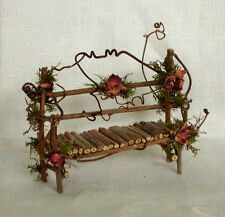 a wooden bench decorated with flowers and vines