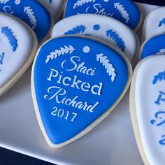 blue and white decorated cookies with names on them