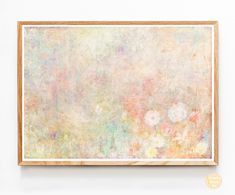 an abstract painting hangs on the wall in front of a wooden frame with flowers painted on it