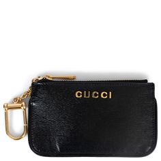 100% authentic Gucci logo card case in black grained leather featuring gold-tone hardware, a zipped top and key chain. Lined in black grosgrain. Has been carried and is in excellent condition. Measurements Model P00938336 Width 13.5cm (5.3in) Height 7.5cm (2.9in) Depth 0.4cm (0.2in) Hardware Gold-Tone All our listings include only the listed item unless otherwise specified in the description above. Chic Gold Gucci Wallet On Chain, Gucci Logo, Card Case Wallet, Luxury Wallet, Gucci Leather, Credit Card Wallet, Leather Logo, Gucci Black, Grace Kelly