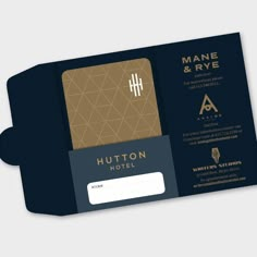 the front and back side of a business card with a gold foil logo on it