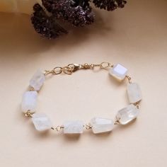 You're a real gem and your jewelry should be too! Make a unique statement in our new chunky Moonstone bracelet. Gorgeous chunks of glowing natural rainbow moonstone create an elegant and mesmerizing piece of jewelry you'll cherish for years to come. Each piece of Moonstone is 100% natural and one of a kind. Your choice of either Gold Filled (shown) or Sterling Silver wire and components. Each bracelet is made to order in your choice of size. Sizing: Small-Medium fits 6 1/2 to 7 inch wrist Medium Moonstone Bracelets With Natural Stones As Gift, Moonstone Gemstone Beaded Bracelet As Gift, Moonstone Bracelets With Natural Stones For Healing, Healing Moonstone Bracelet With Natural Stones, Everyday Moonstone Bracelets With Gemstone Beads, Everyday Moonstone Gemstone Beads Bracelets, Moonstone Bracelet Jewelry Gift, Moonstone Bracelet Jewelry For Gifts, Moonstone Gemstone Beads Jewelry For Healing