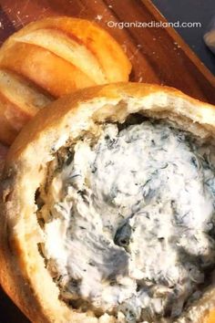 an open bread bowl filled with blue cheese