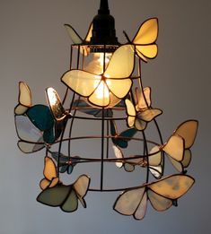 a chandelier made out of stained glass butterflies