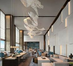 the interior of a modern restaurant with large windows and chandeliers hanging from the ceiling