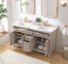 a bathroom with two sinks and mirrors on the wall next to a bath room rug