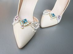 "Fun and flirty sparkly shoe clips made with the finest Swarovski crystals. Mix and match for a unique personalized look. Each clip measures 1\" wide and 1 1/4\" long. Available in gold, rose gold or silver finish. Easy to use clip-on style. The price includes one pair of clips. Available in aquamarine, amethyst or all clear crystal." Elegant Gold Shoe Clips With Rhinestones, Elegant Gold Rhinestone Shoe Clips, Glamorous Rhinestone Shoe Clips, Glamorous Silver Shoe Clips With Rhinestones, Sparkly Shoes, Jeweled Shoes, Rhinestone Shoes, Crystal Shoes, Wedding Sash Belt