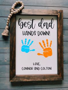 a sign that says best dad hands down and love, connor and cotton on it