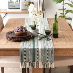 a wooden table topped with a bowl of flowers