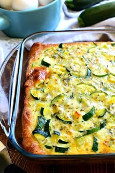 a casserole dish with zucchini and cheese