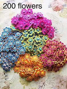 there are many different colors of flowers on this table cloth with the words, 200 flowers