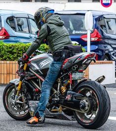 a man riding on the back of a motorcycle