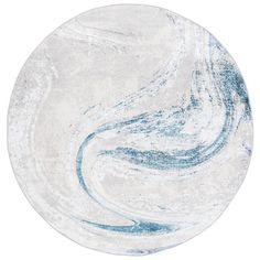 a white and blue circular rug with swirls on the bottom, in front of a white background