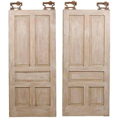 two wooden doors with handles on each side